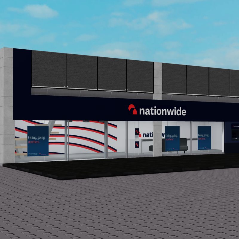 A two-storey bank building with a Nationwide sign, glass frontage and cash machines.
