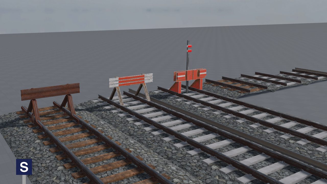 Wooden and concrete sleeper track with three styles of buffer stop.